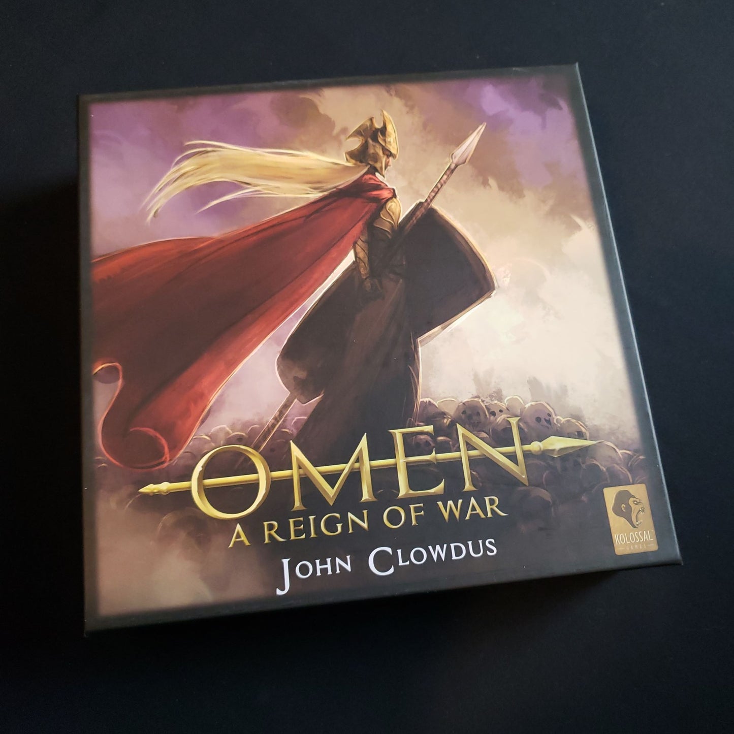 Image shows the front cover of the box of the Omen: A Reign of War card game