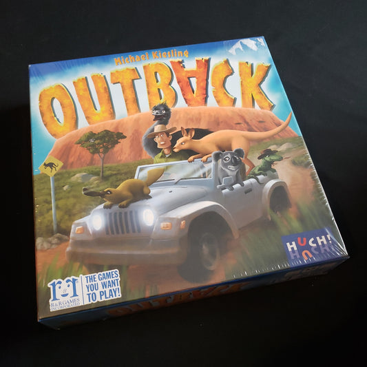 Image shows the front cover of the box of the Outback board game