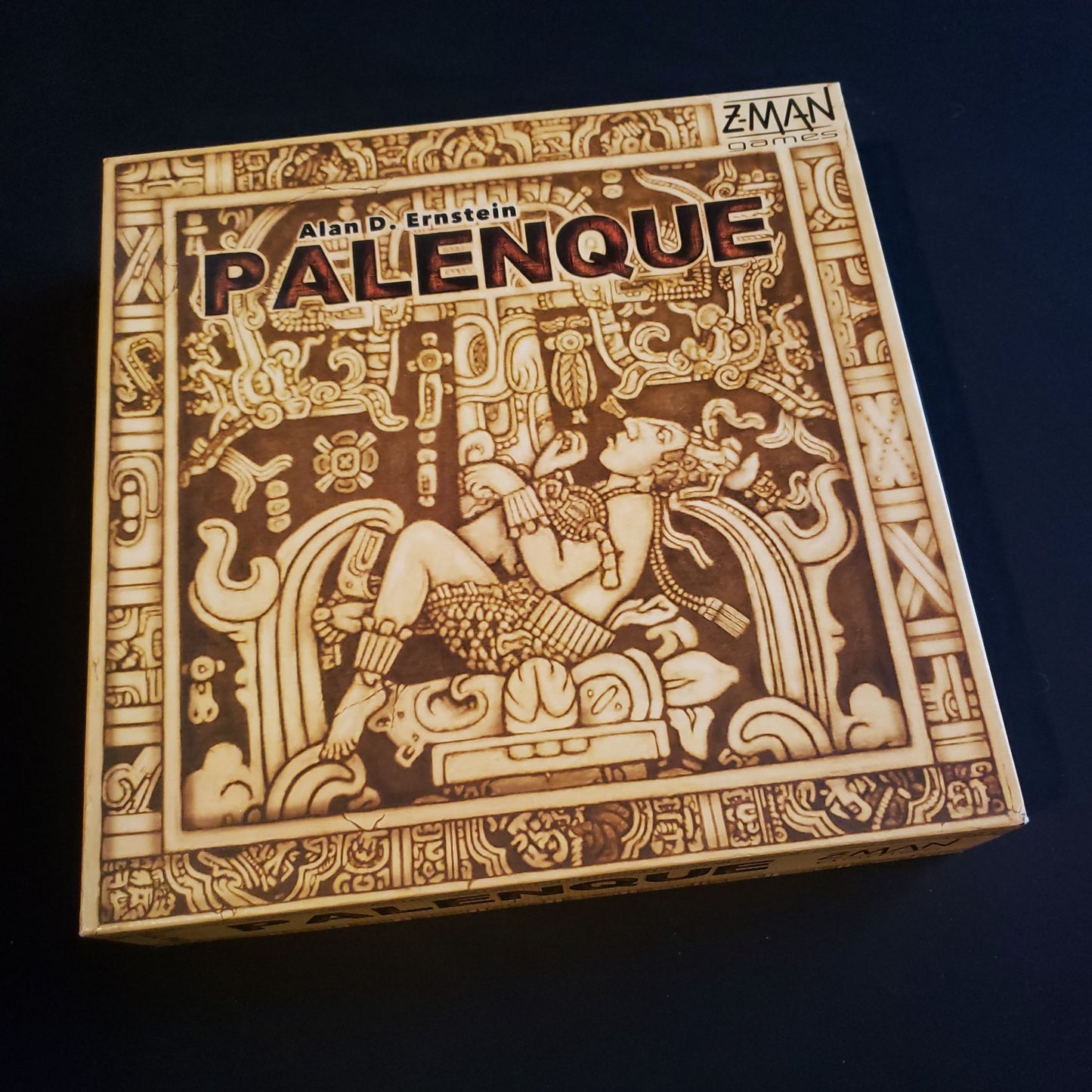 Image shows the front cover of the box of the Palenque board game