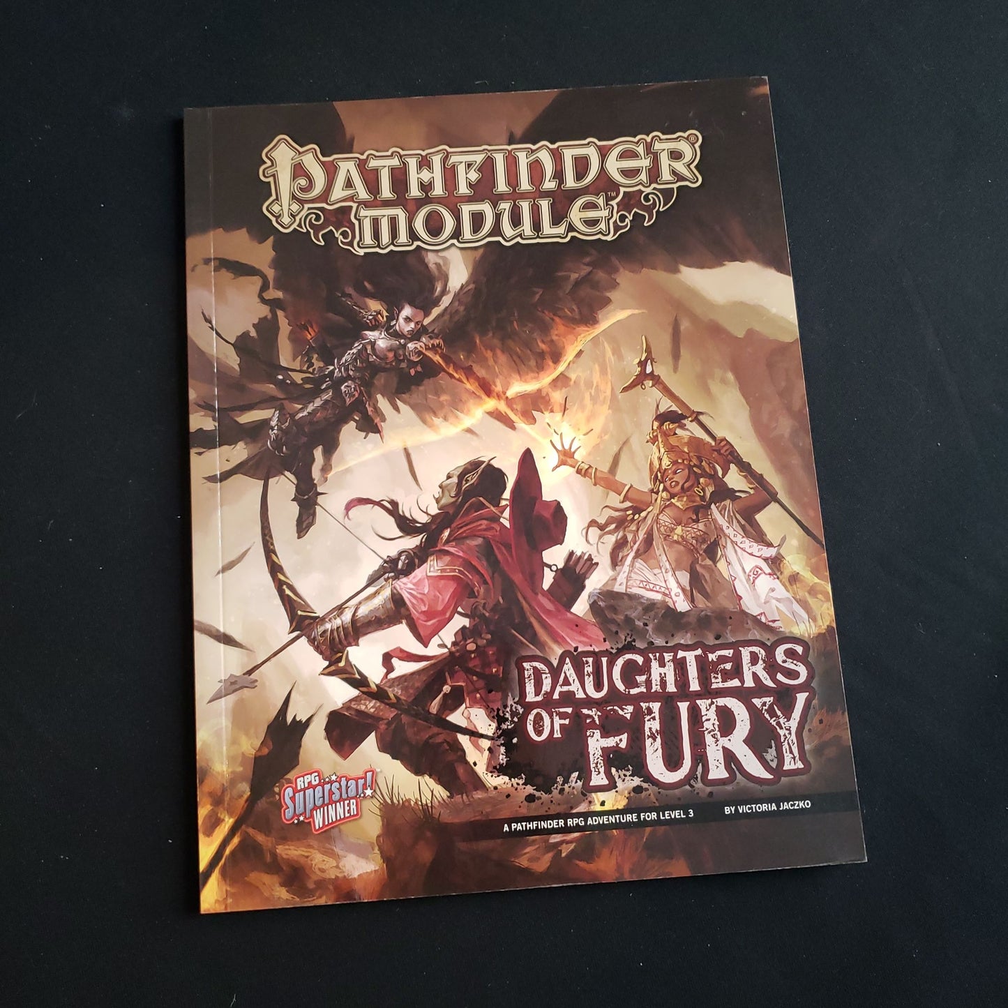 Image shows the front cover of the Daughters of Fury book for the Pathfinder First Edition roleplaying game