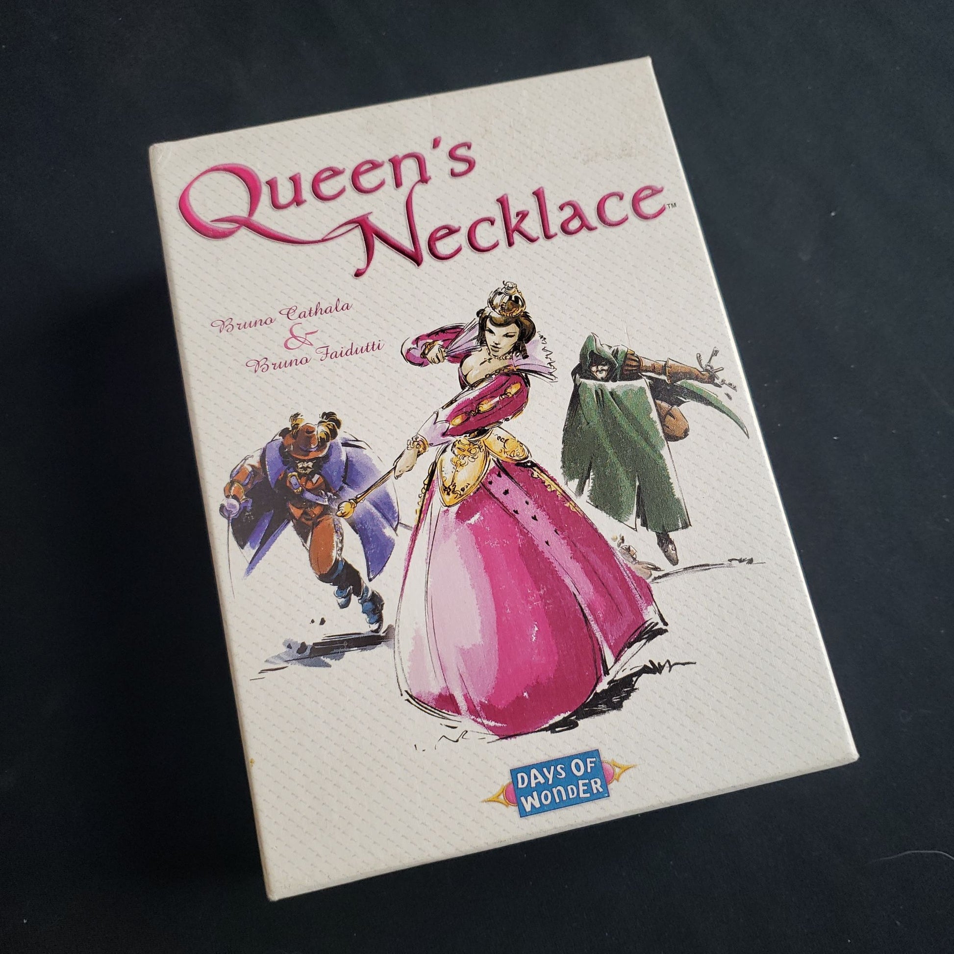 Image shows the front cover of the box of the Queen's Necklace card game