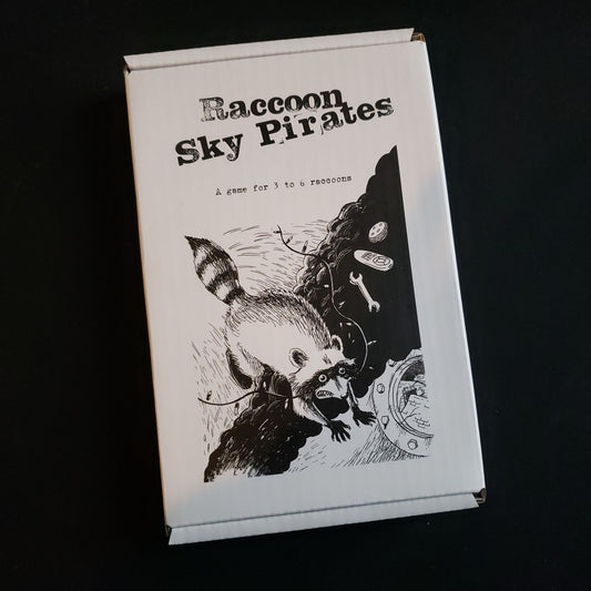 Image shows the front cover of the Raccoon Sky Pirates roleplaying game box set