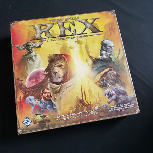 Image shows the front cover of the box of the Rex: Final Days Of An Empire board game