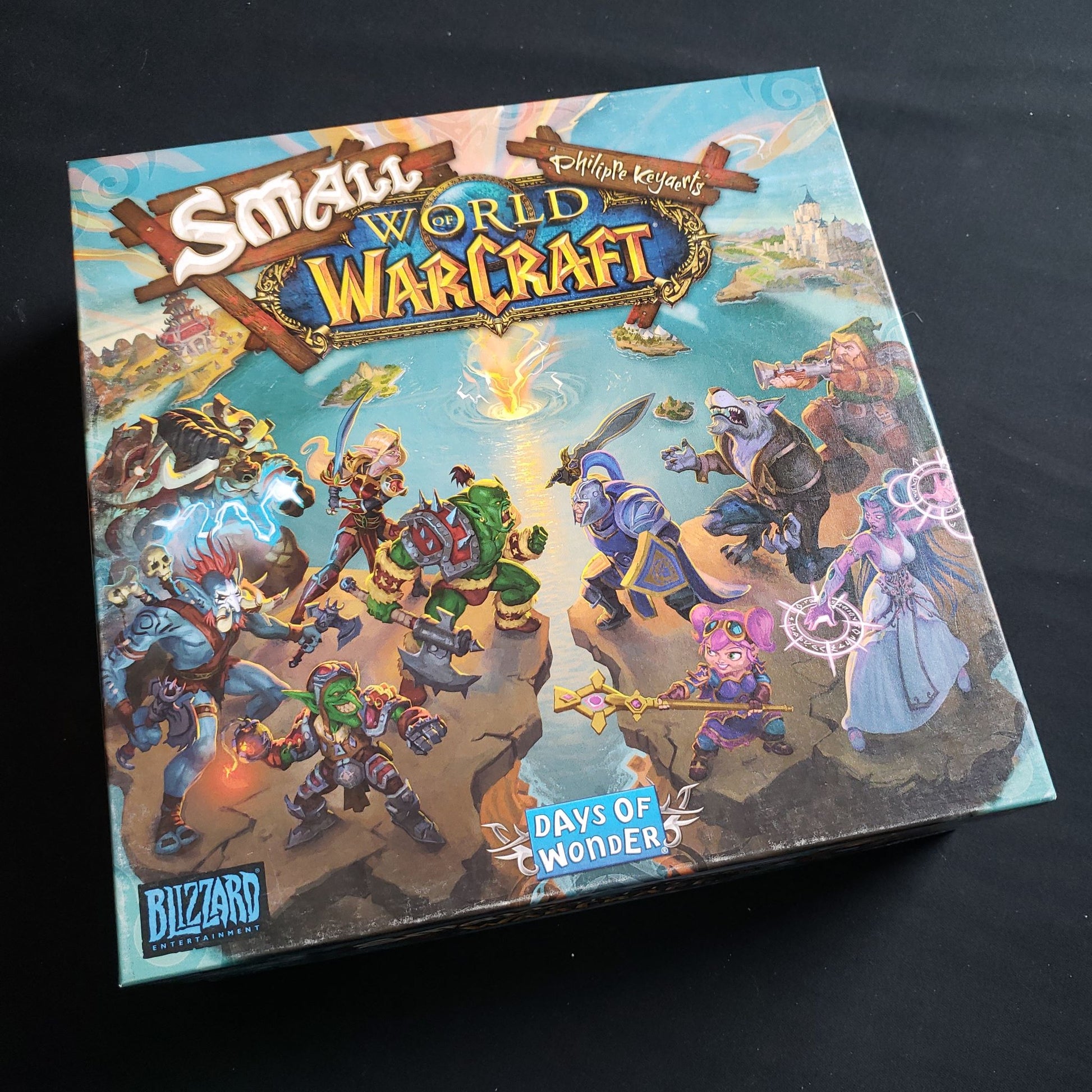 Image shows the front cover of the box of the Small World Of Warcraft board game