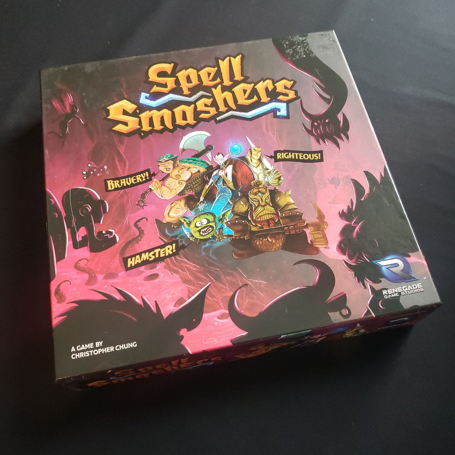 Image shows the front cover of the box of the Spell Smashers board game