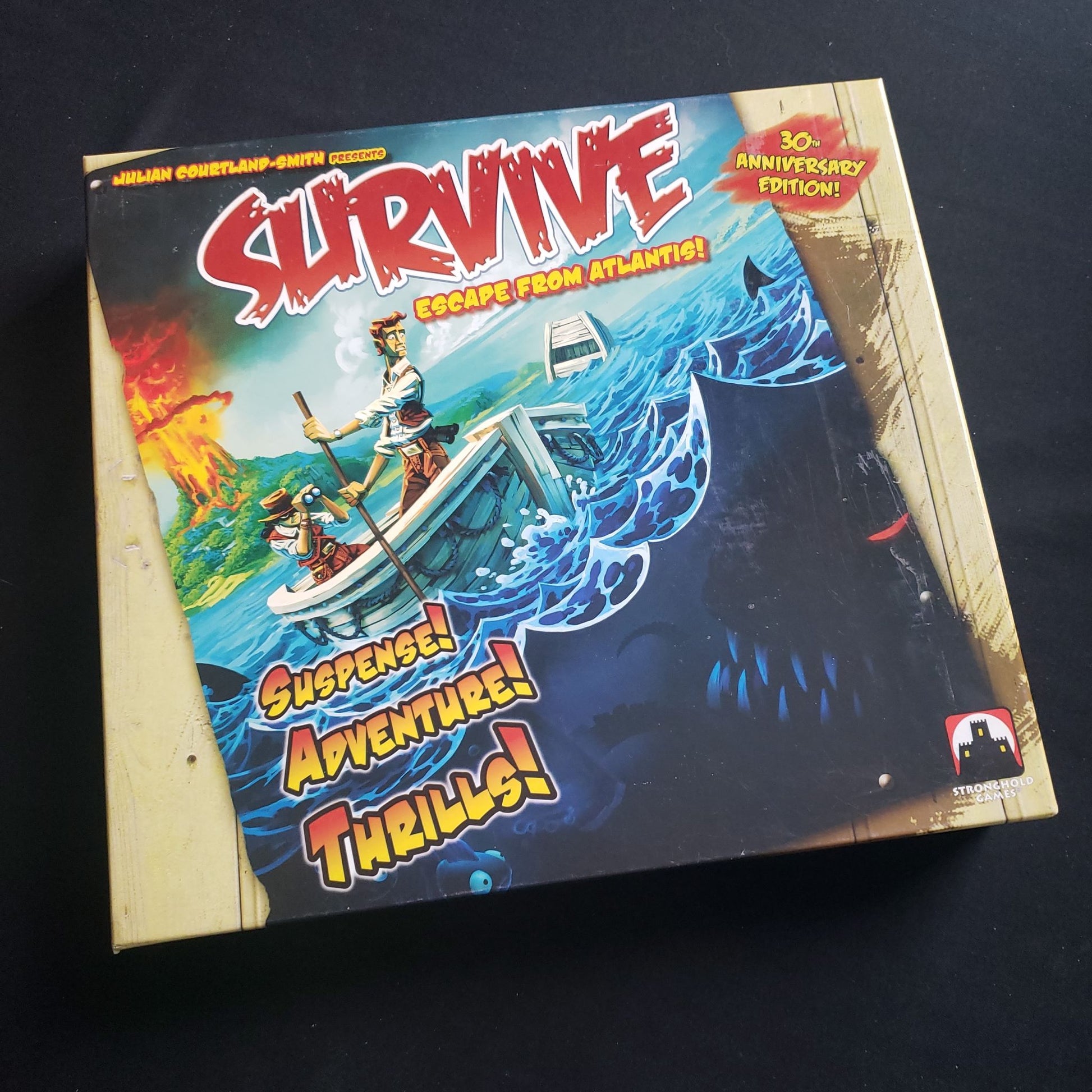 Image shows the front cover of the box of the Survive: escape From Atlantis board game