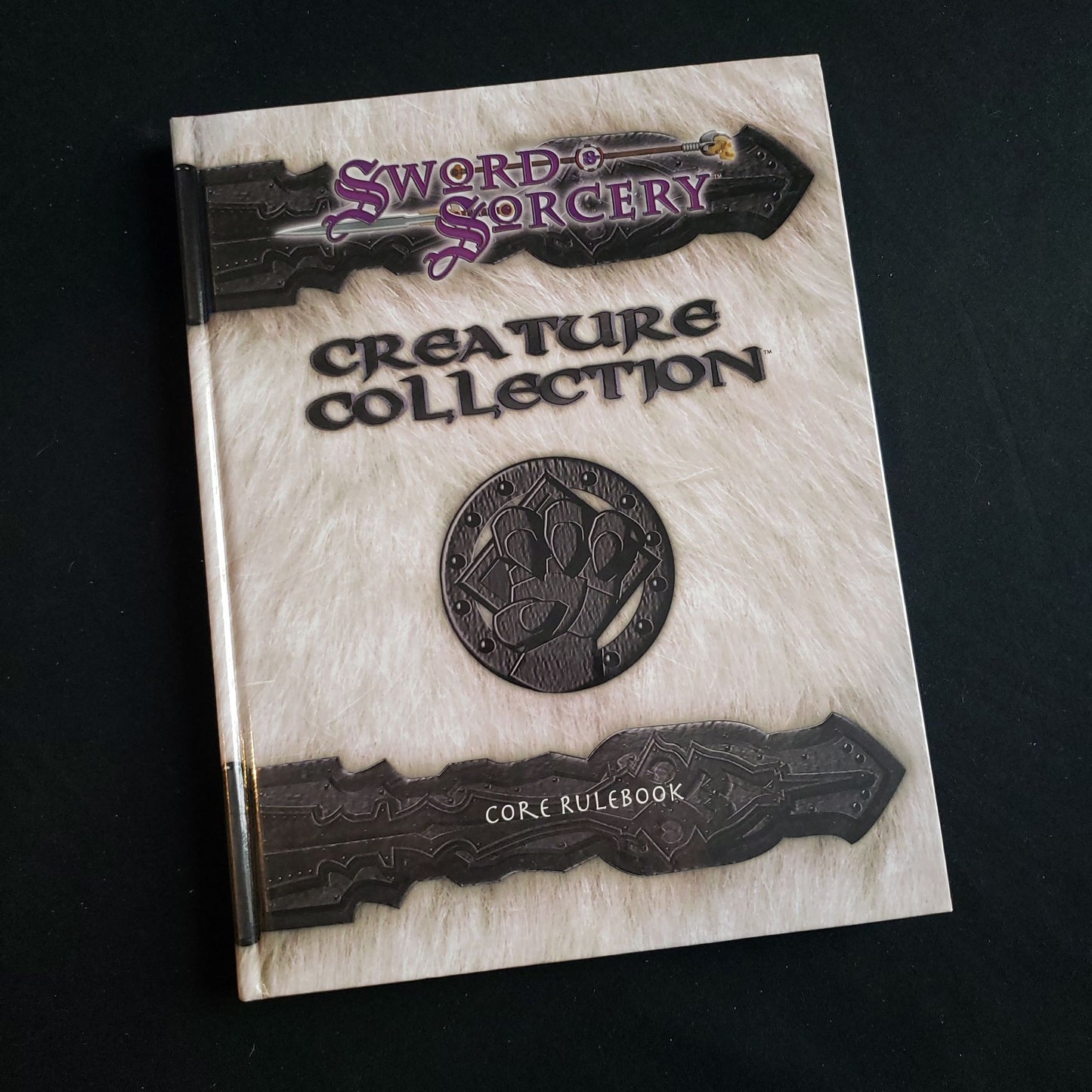 Image shows the front cover of the Creature Collection book for the Sword & Sorcery roleplaying game