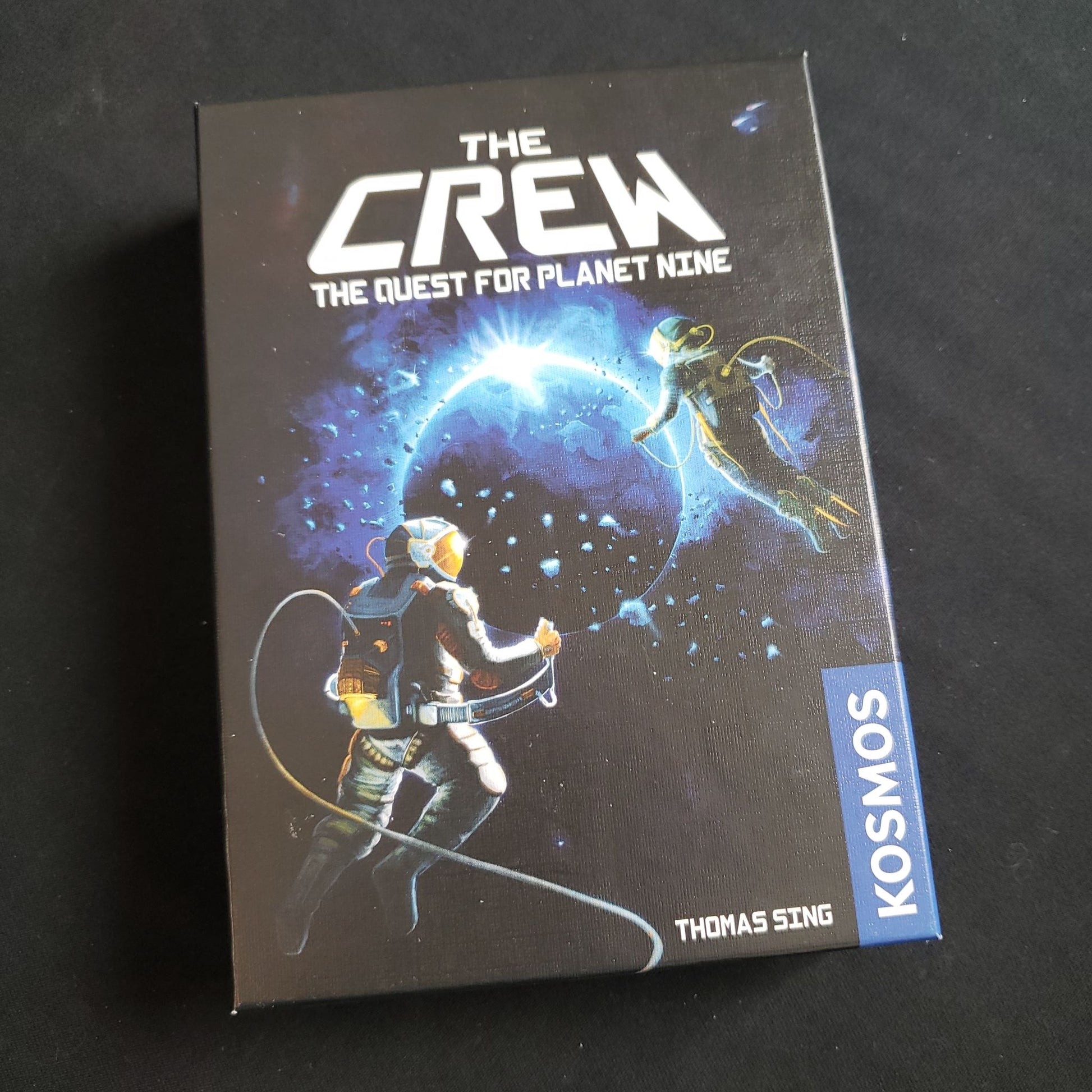 Image shows the front cover of the box of The Crew: The Quest for Planet Nine card game