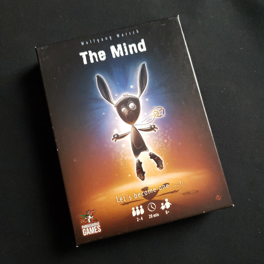 Image shows the front cover of the box of the Mind card game