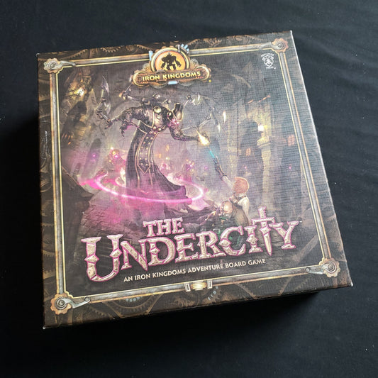 Image shows the front cover of the box of the Undercity board game
