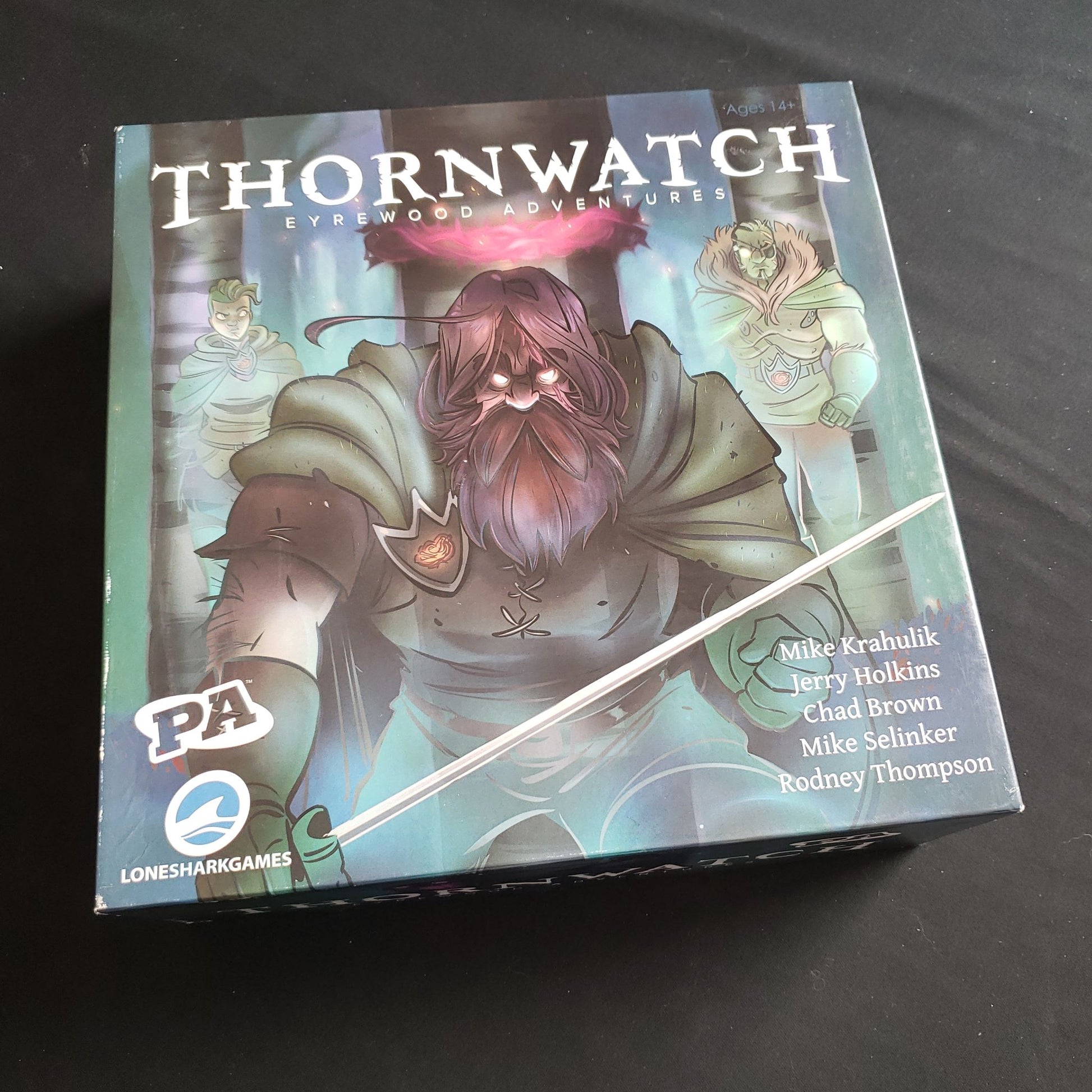 Image shows the front cover of the box of the Thornwatch board game