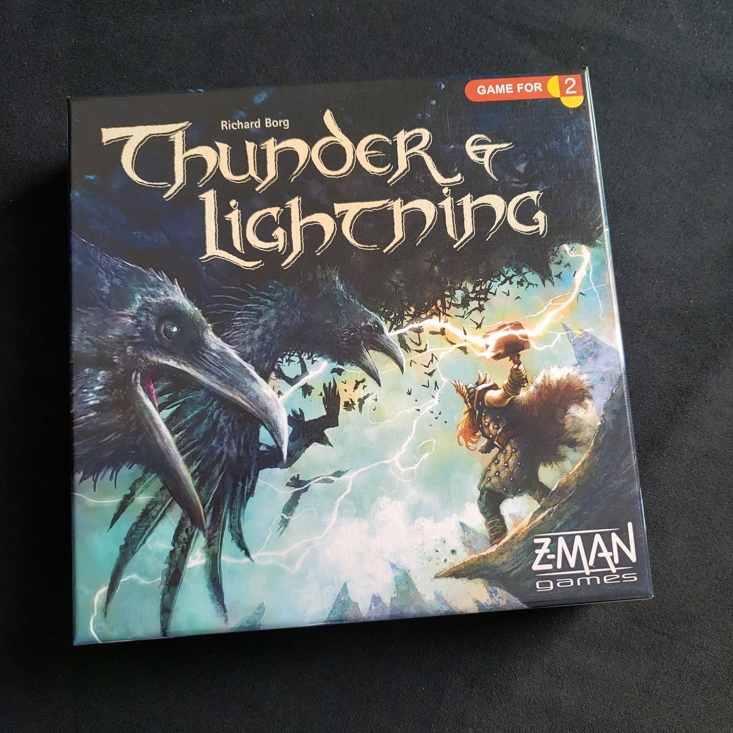 Image shows the front cover of the box of the Thunder and Lightning card game