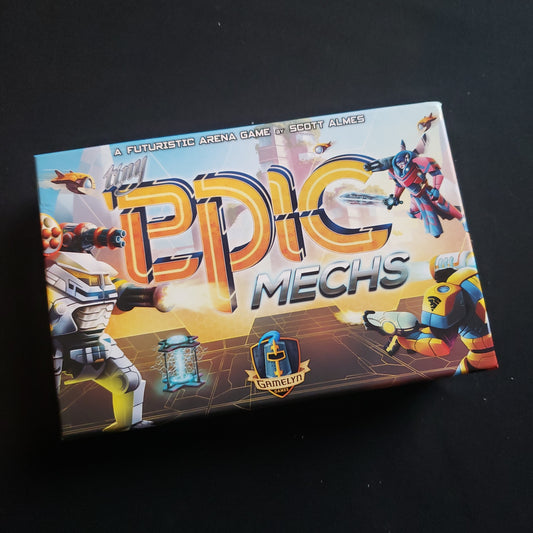 Image shows the front cover of the box of the Tiny Epic Mechs board game