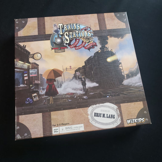 Image shows the front cover of the box of the Trains and Stations board game