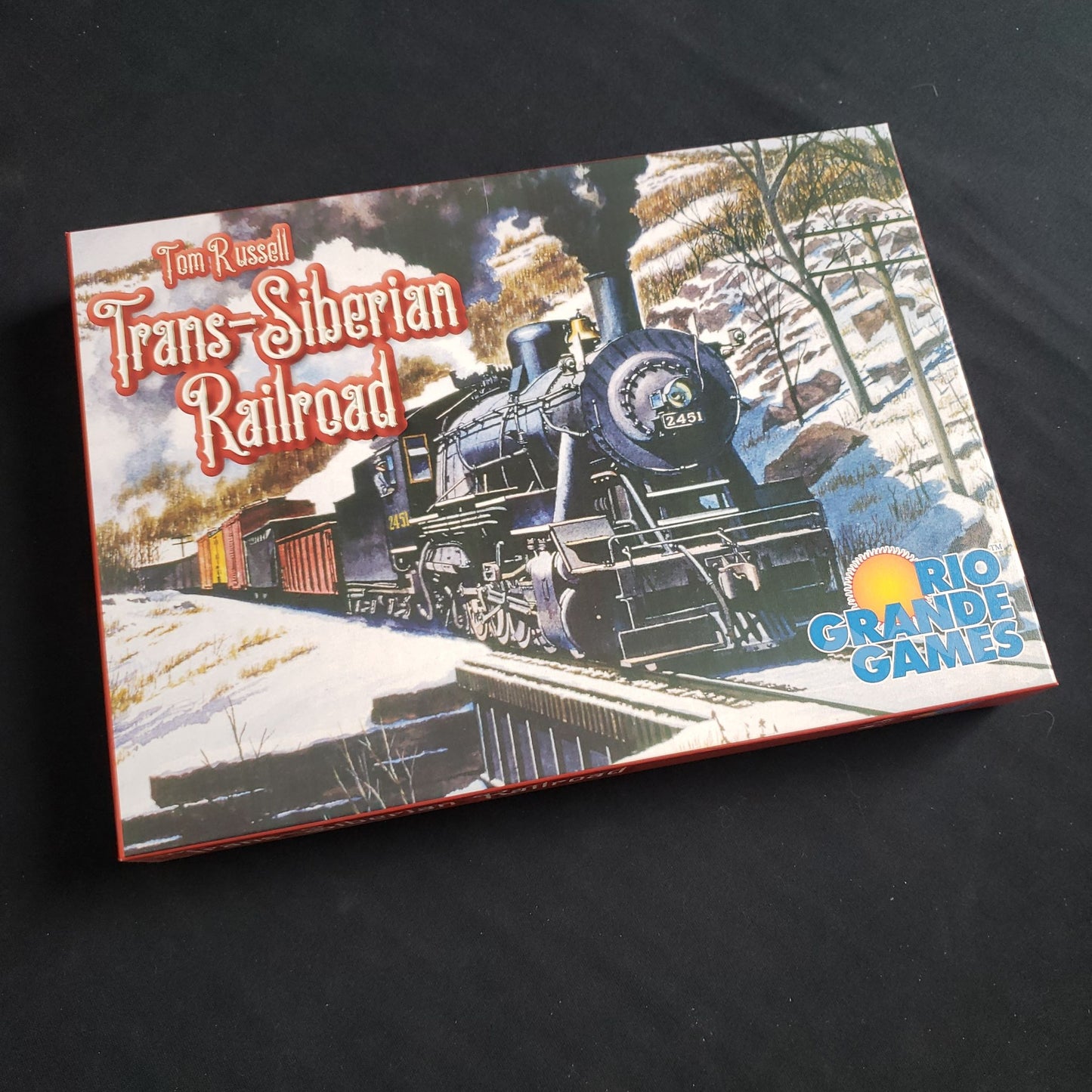 Image shows the front cover of the box of the Trans-Siberian Railroad board game