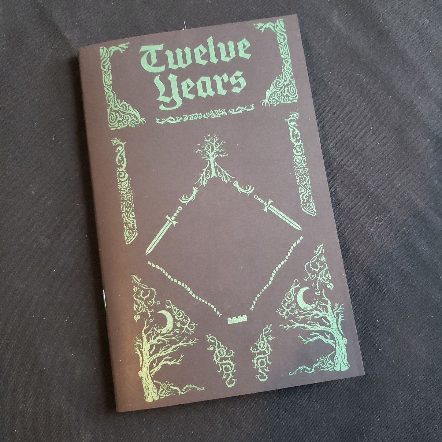 Image shows the front cover of the Twelve Years roleplaying game book