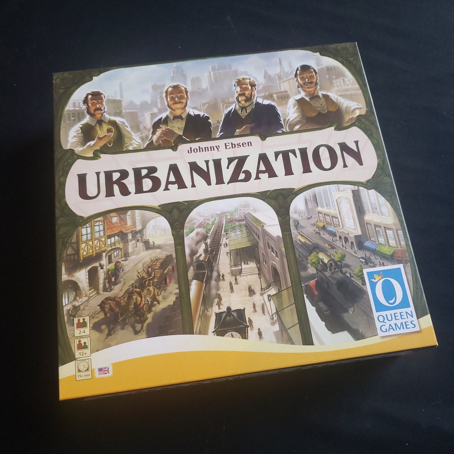 Image shows the front cover of the box of the Urbanization board game
