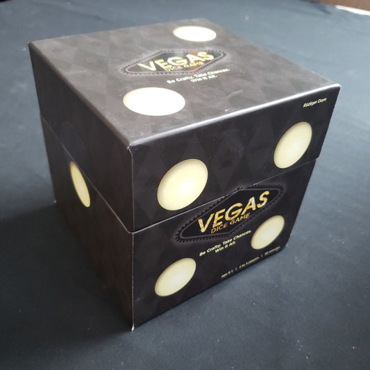 Image shows the front cover of the box of the Vegas Dice Game