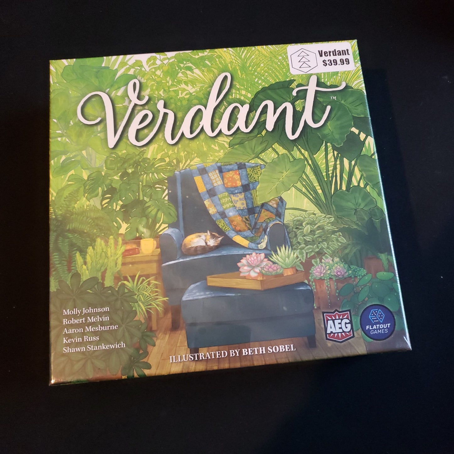 Image shows the front cover of the box of the Verdant board game