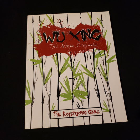 Image shows the front cover of the Core Rulebook for the Wu Xing: The Ninja Crusade roleplaying game