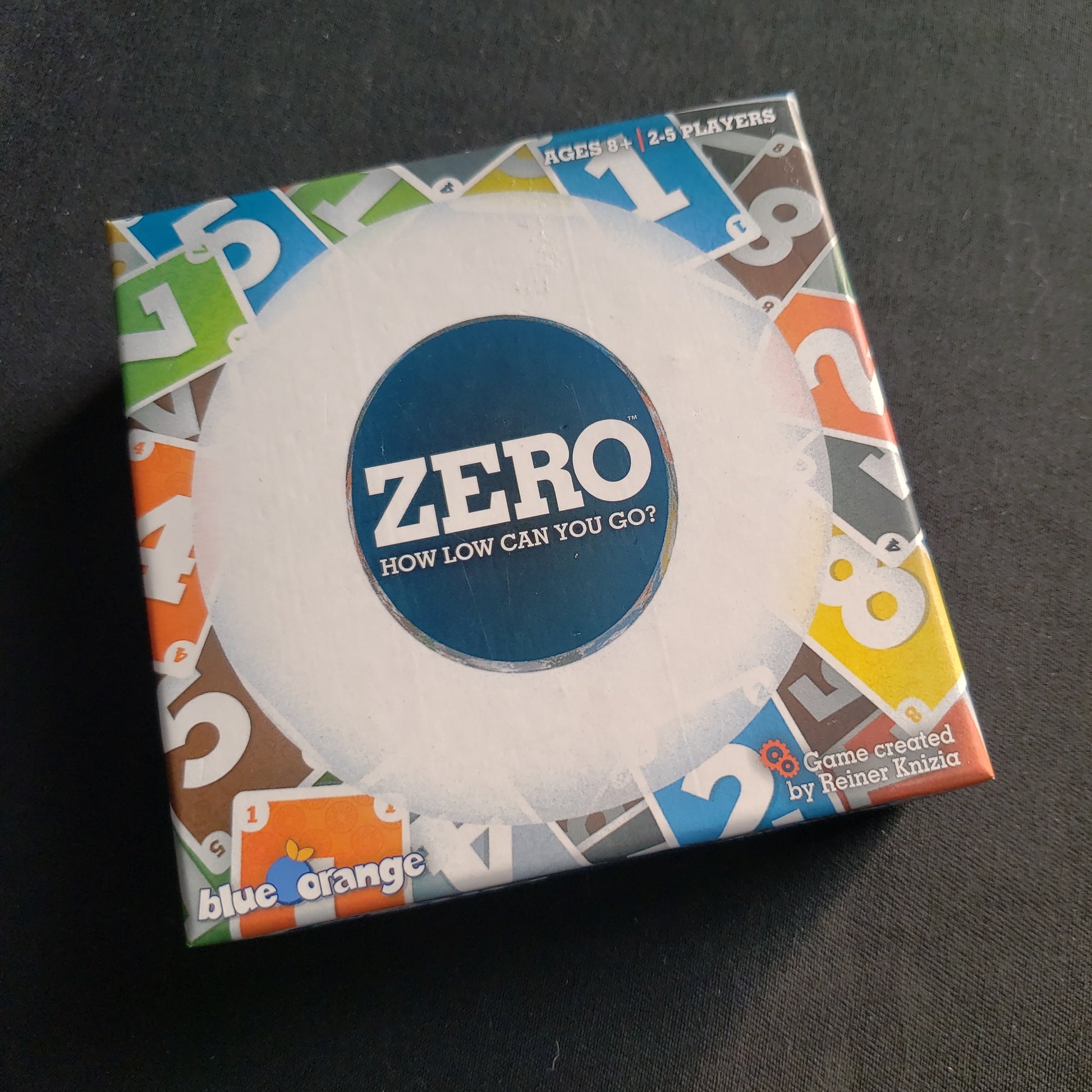 Image shows the front cover of the box of the Zero card game